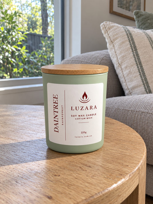 Daintree rainforest soy candle 235g in a sage-green glass jar with bamboo lid by Luzara