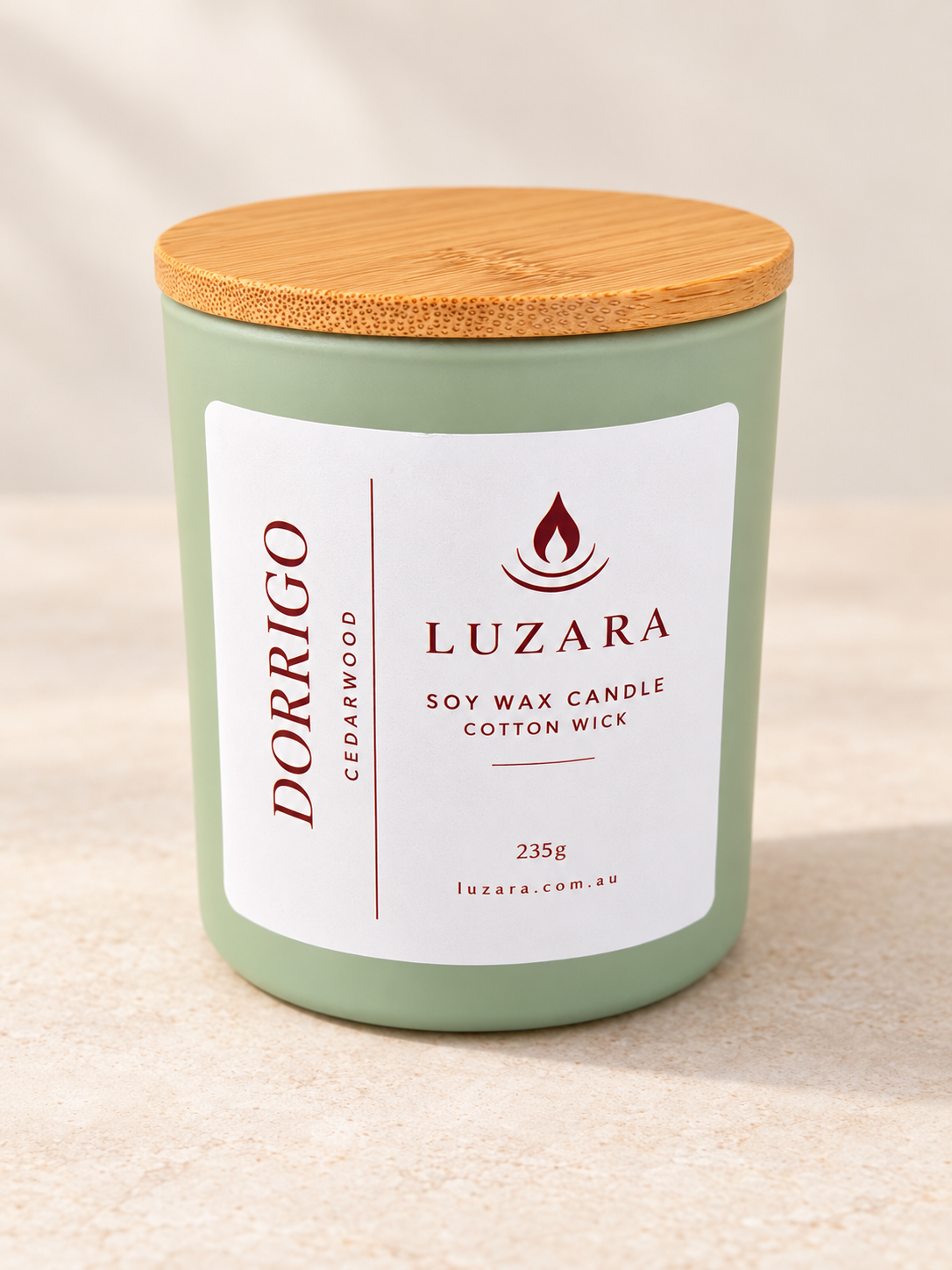Dorrigo Cedar Wood 235g soy candle in a sage-green vessel with bamboo lid by Luzara