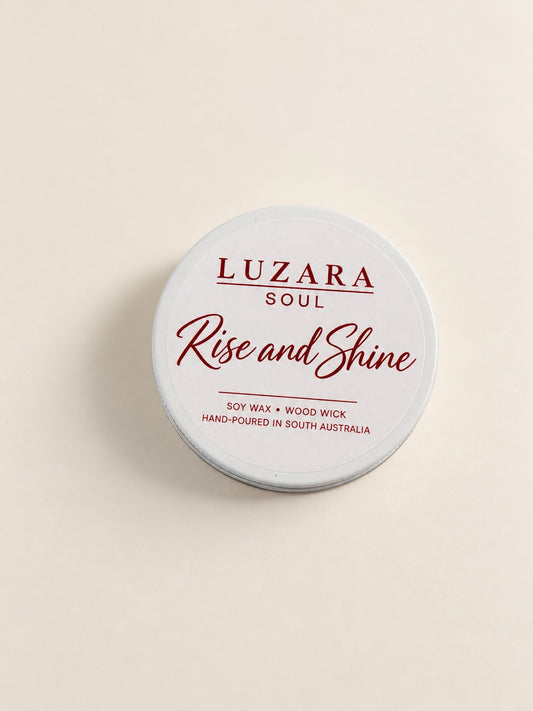 Rise and Shine 60g travel tin soy candle from the Luzara Soul Collection